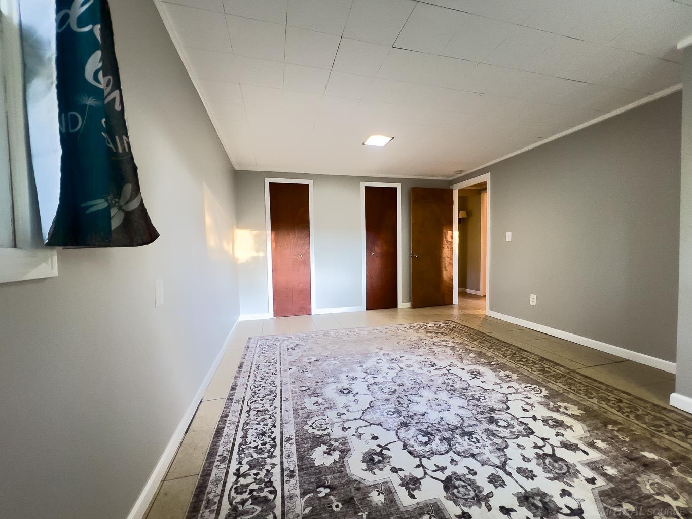 1123 Radov Road Gladwin, MI 48624 - Photo 16 of 29 Complete with 2 closets full of deep shelves for extra storage.