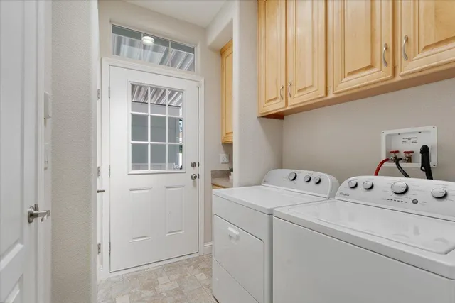 a bedroom with bed couch and window