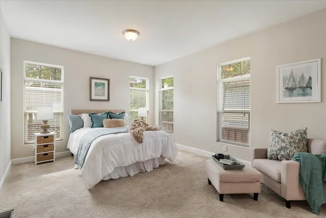 a bedroom with a bed and couch