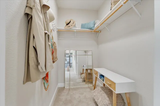a view of a house with wooden floor and white walls