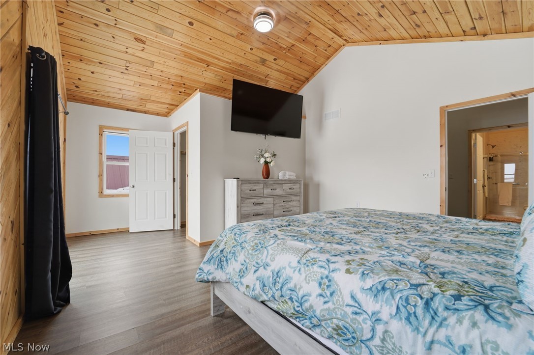 5919 Lake Road West, Unit 32 Ashtabula, OH 44004 - Photo 16 of 23 Bedroom featuring a vaulted wooden ceiling and wood finished floors