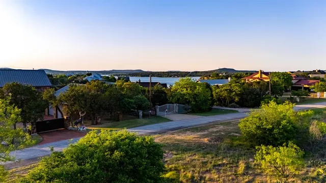 an aerial view of a house with a yard basket ball court and outdoor seating