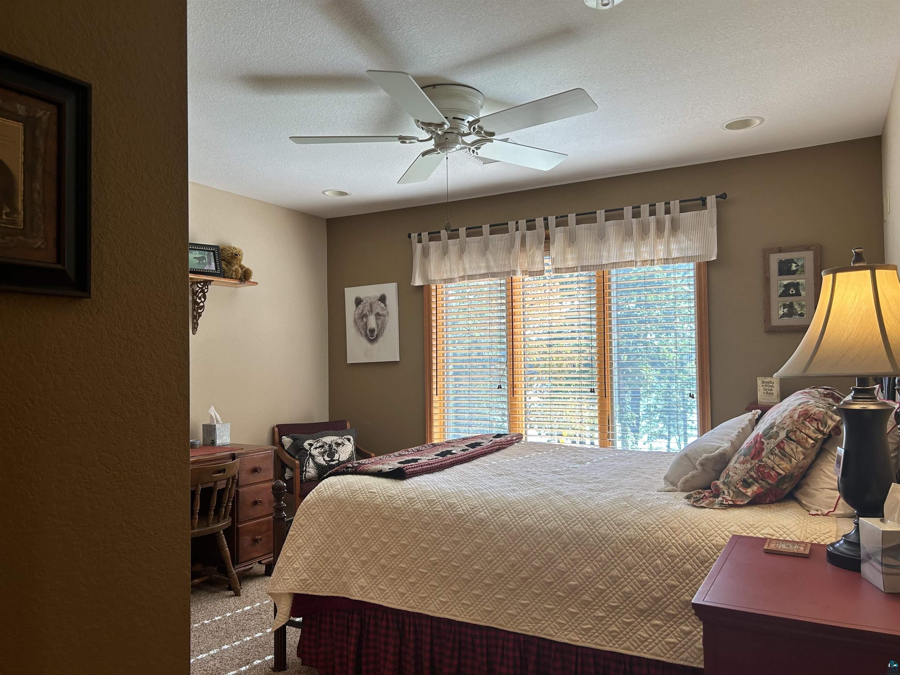 10115 Island Lake Road Solon Springs, WI 54873 - Photo 34 of 56 Carpeted bedroom featuring ceiling fan