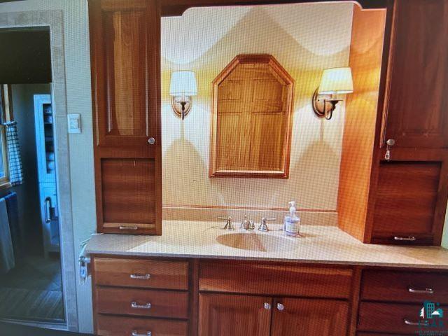10115 Island Lake Road Solon Springs, WI 54873 - Photo 37 of 56 Bathroom featuring vanity and backsplash
