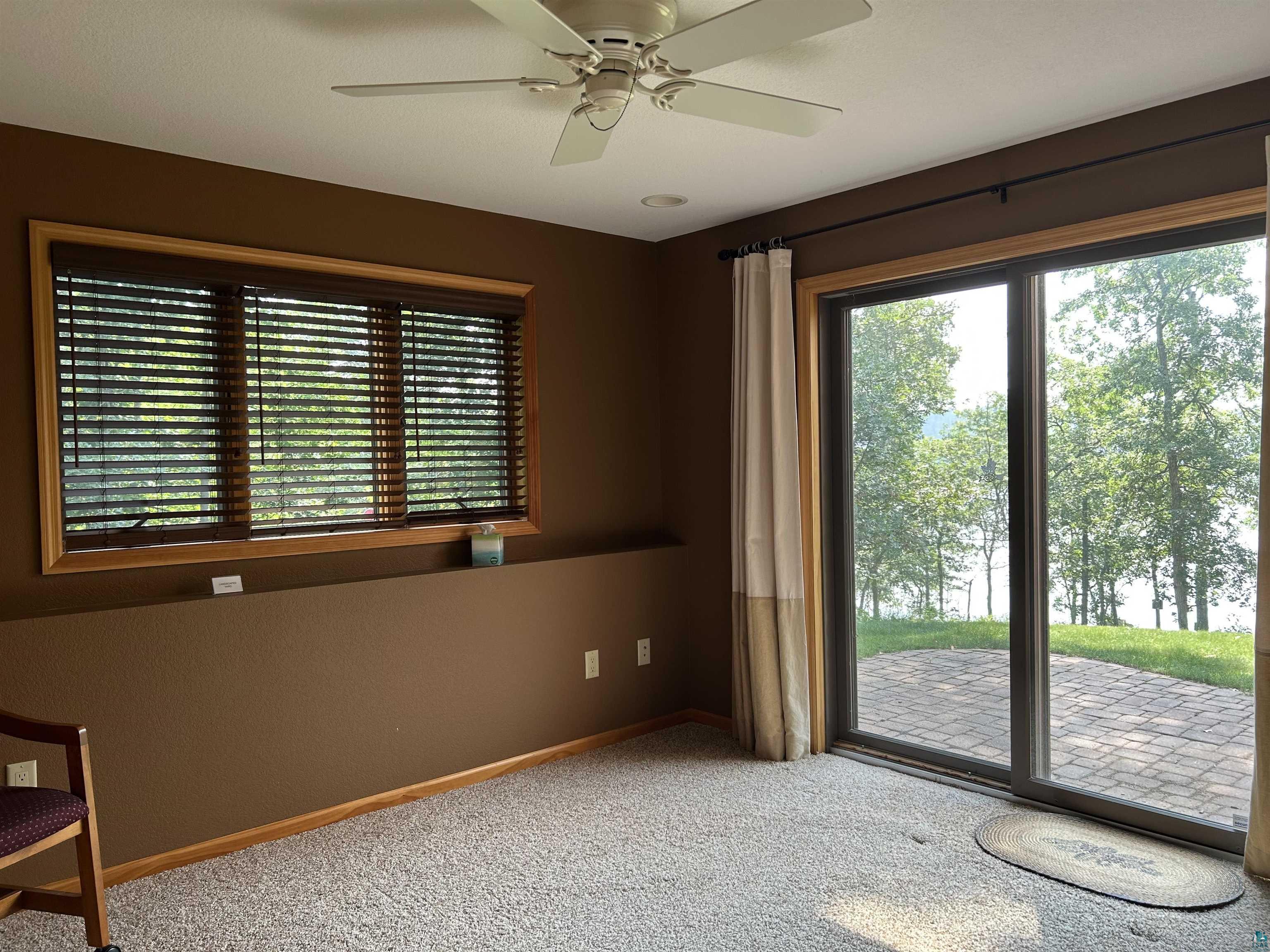 10115 Island Lake Road Solon Springs, WI 54873 - Photo 45 of 56 Carpeted spare room featuring baseboards and a ceiling fan