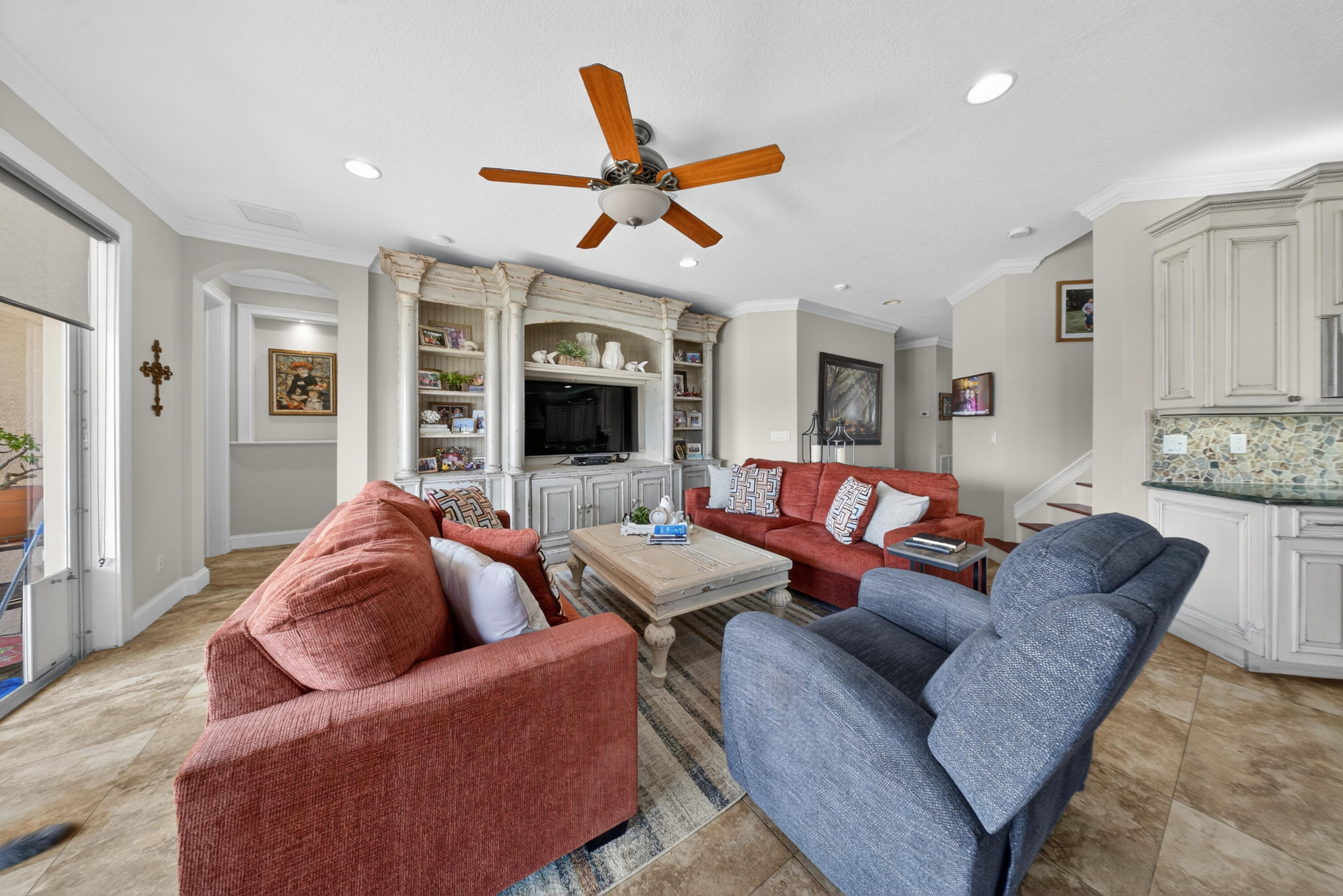 1315 Southeast Conference Circle Stuart, FL 34997 - Photo 12 of 55 a living room with furniture a ceiling fan and a window
