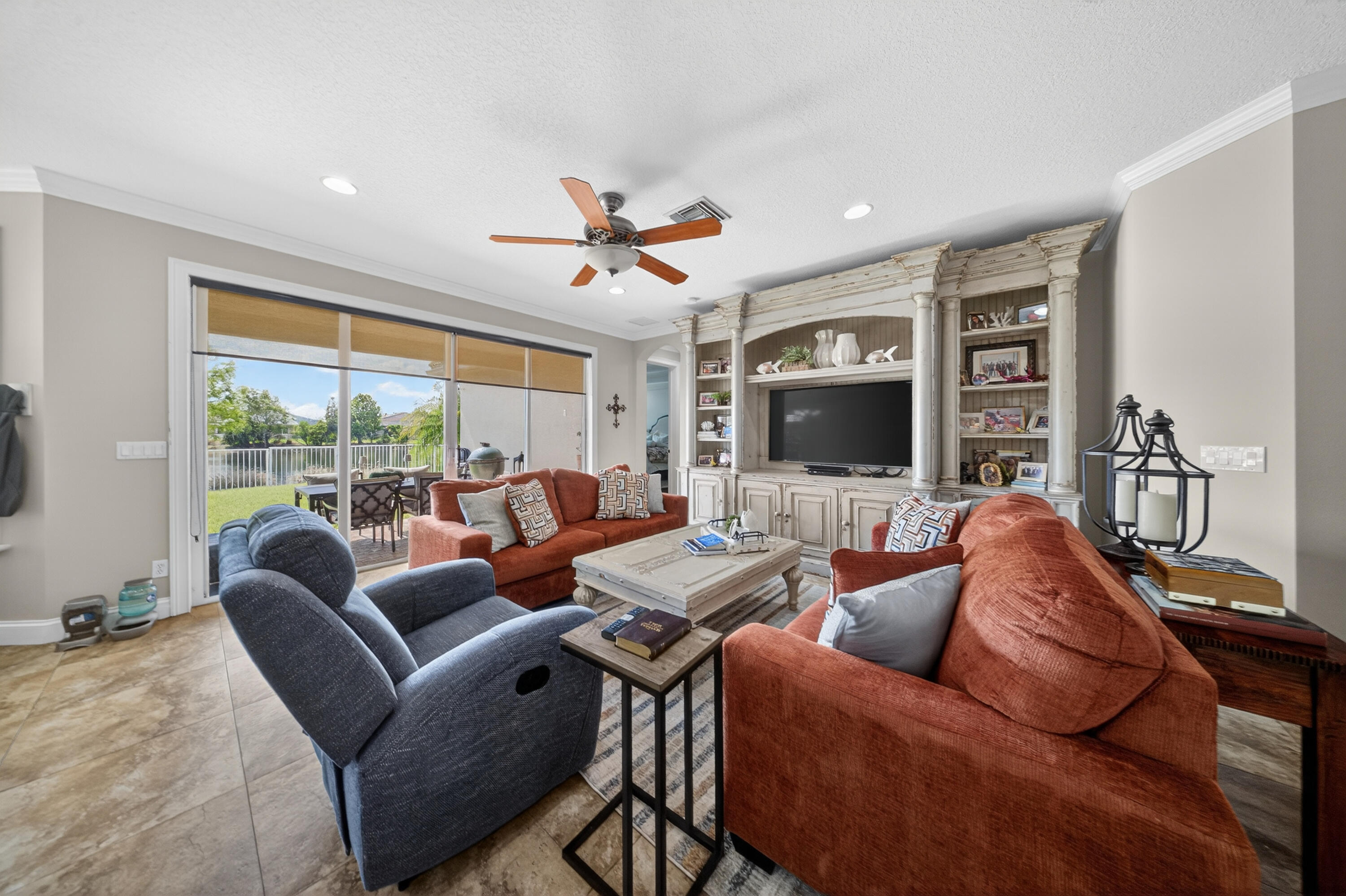 1315 Southeast Conference Circle Stuart, FL 34997 - Photo 13 of 55 a living room with furniture a flat screen tv and a large window