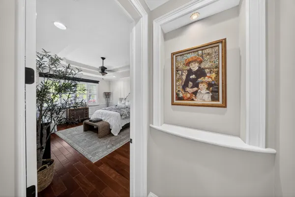 a bed room with a bed and a chandelier