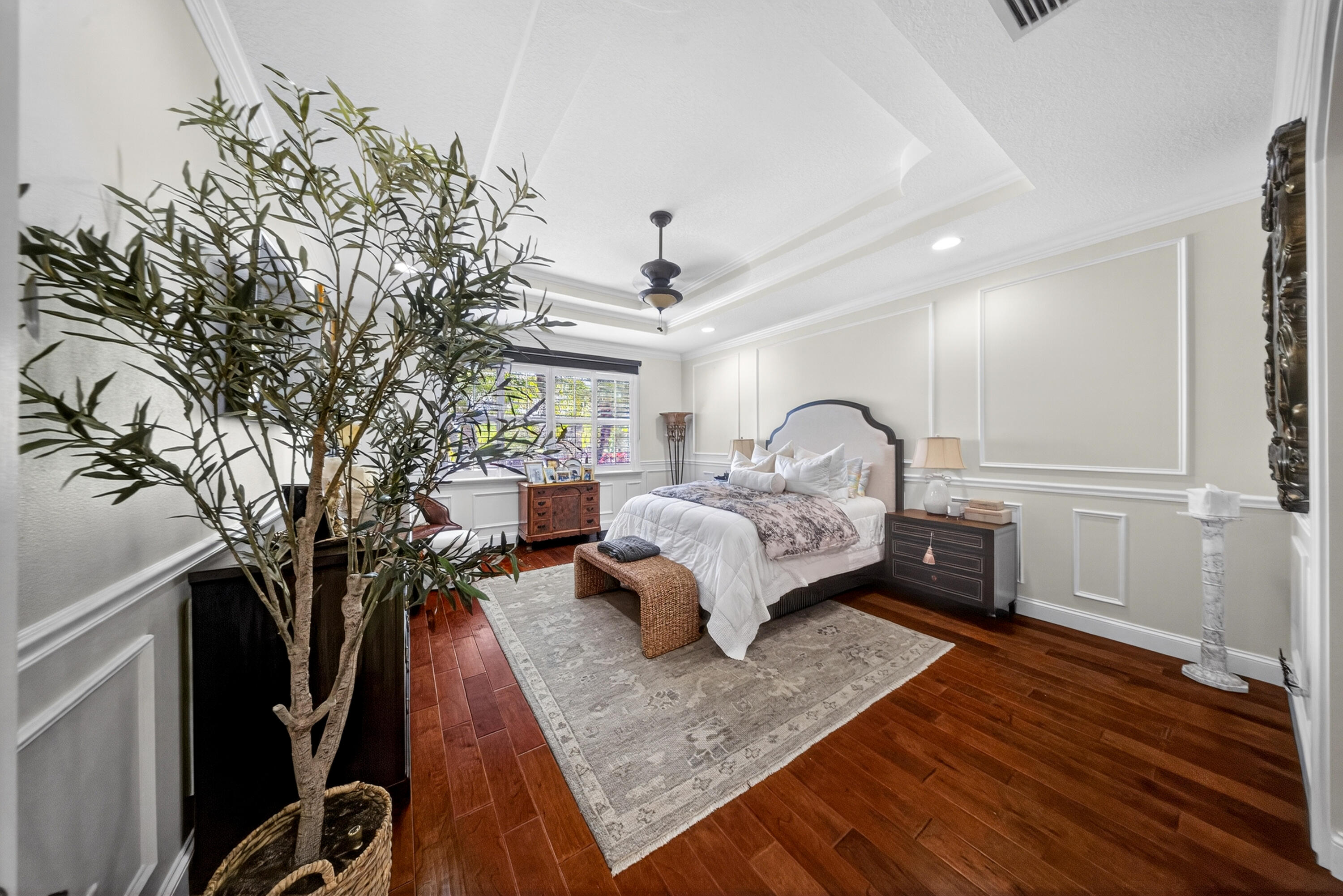 1315 Southeast Conference Circle Stuart, FL 34997 - Photo 22 of 55 a bed room with a bed and a chandelier