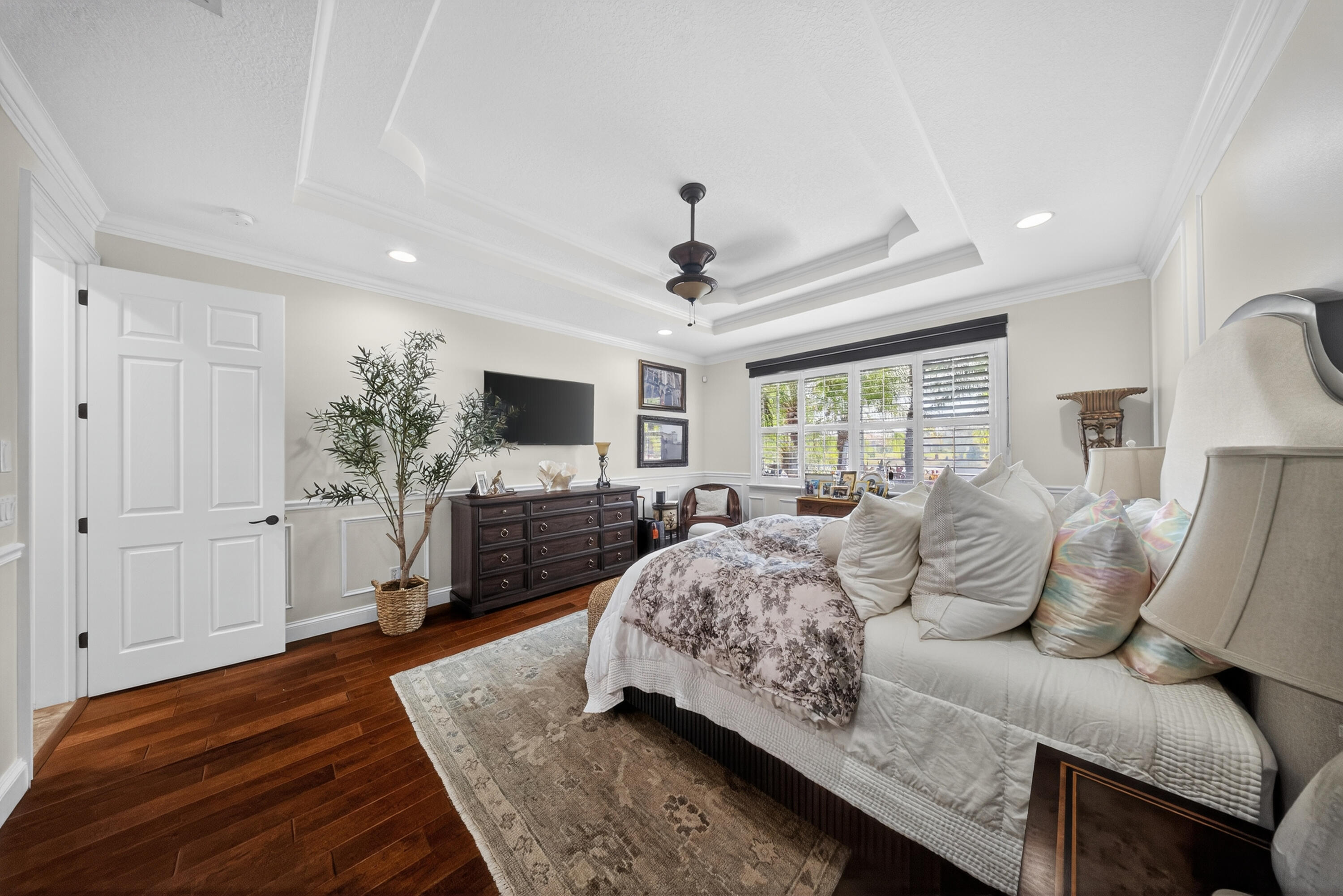 1315 Southeast Conference Circle Stuart, FL 34997 - Photo 26 of 55 a spacious bedroom with a bed and a flat screen television
