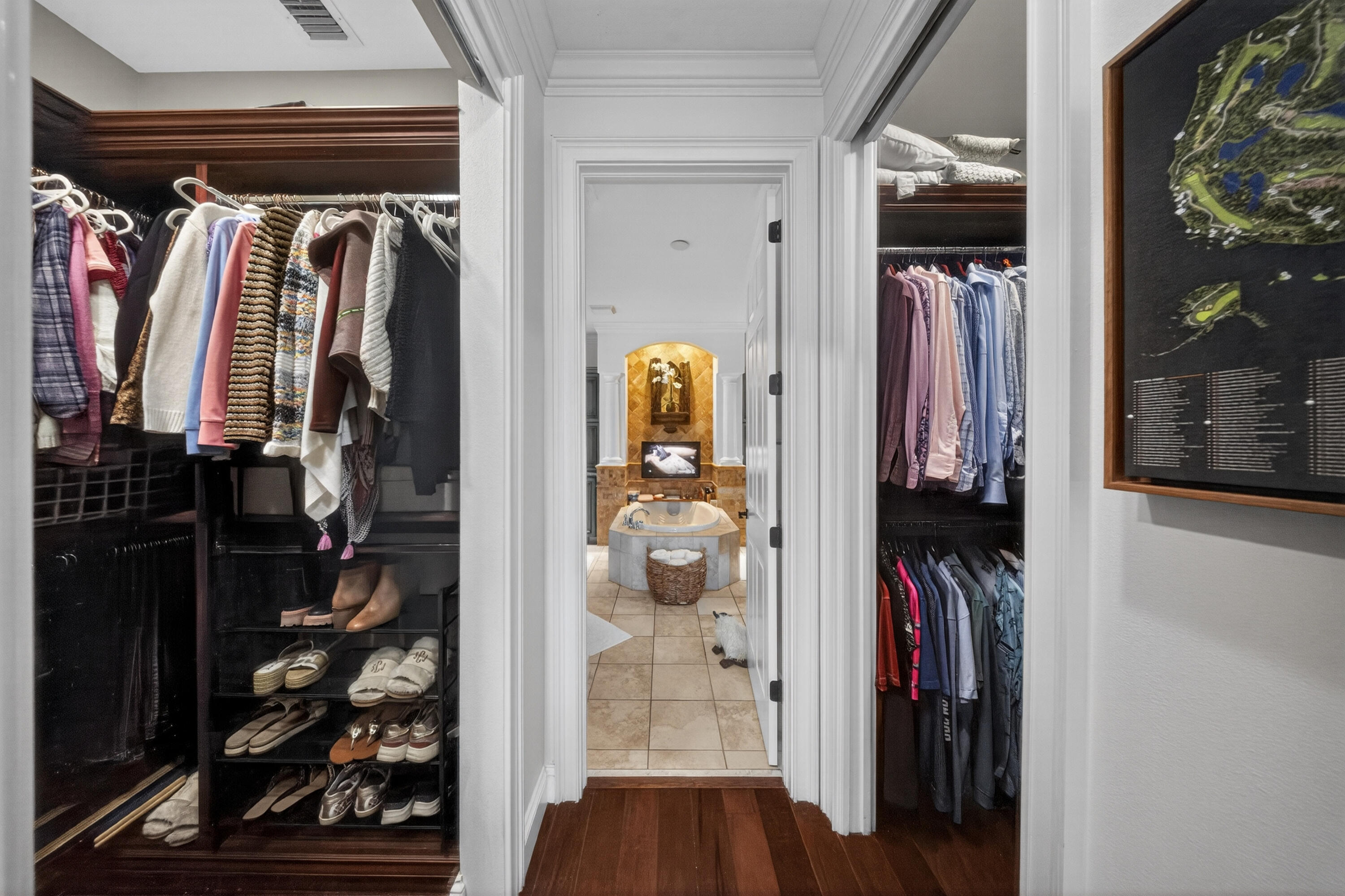 1315 Southeast Conference Circle Stuart, FL 34997 - Photo 28 of 55 a view of walk in closet with clothes and shoes