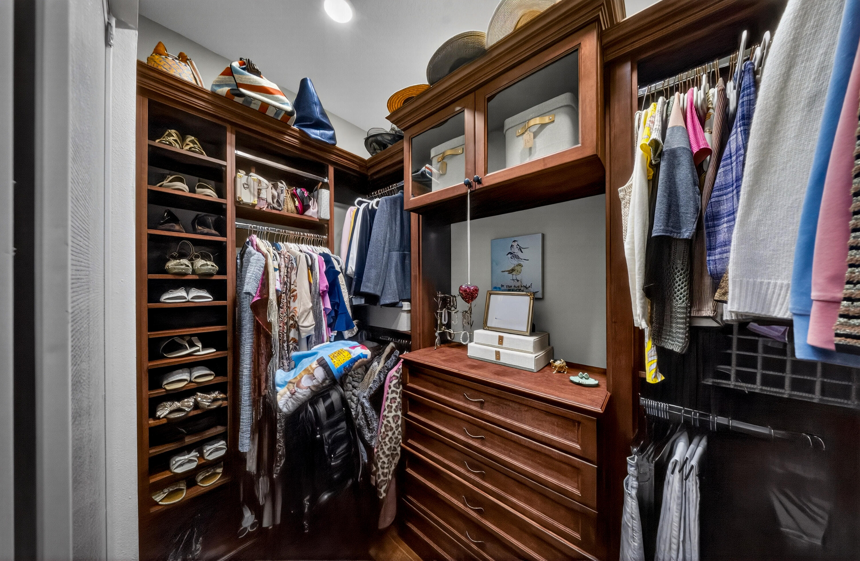 1315 Southeast Conference Circle Stuart, FL 34997 - Photo 30 of 55 a view of walk in closet with clothes and shoes