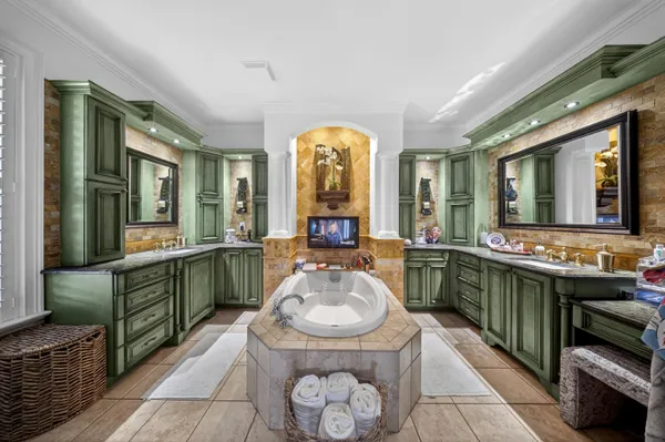a spacious bathroom with sink and mirror