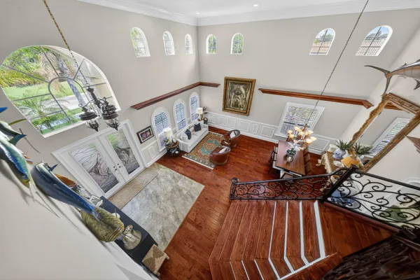 a living room with lots of furniture and a book shelf