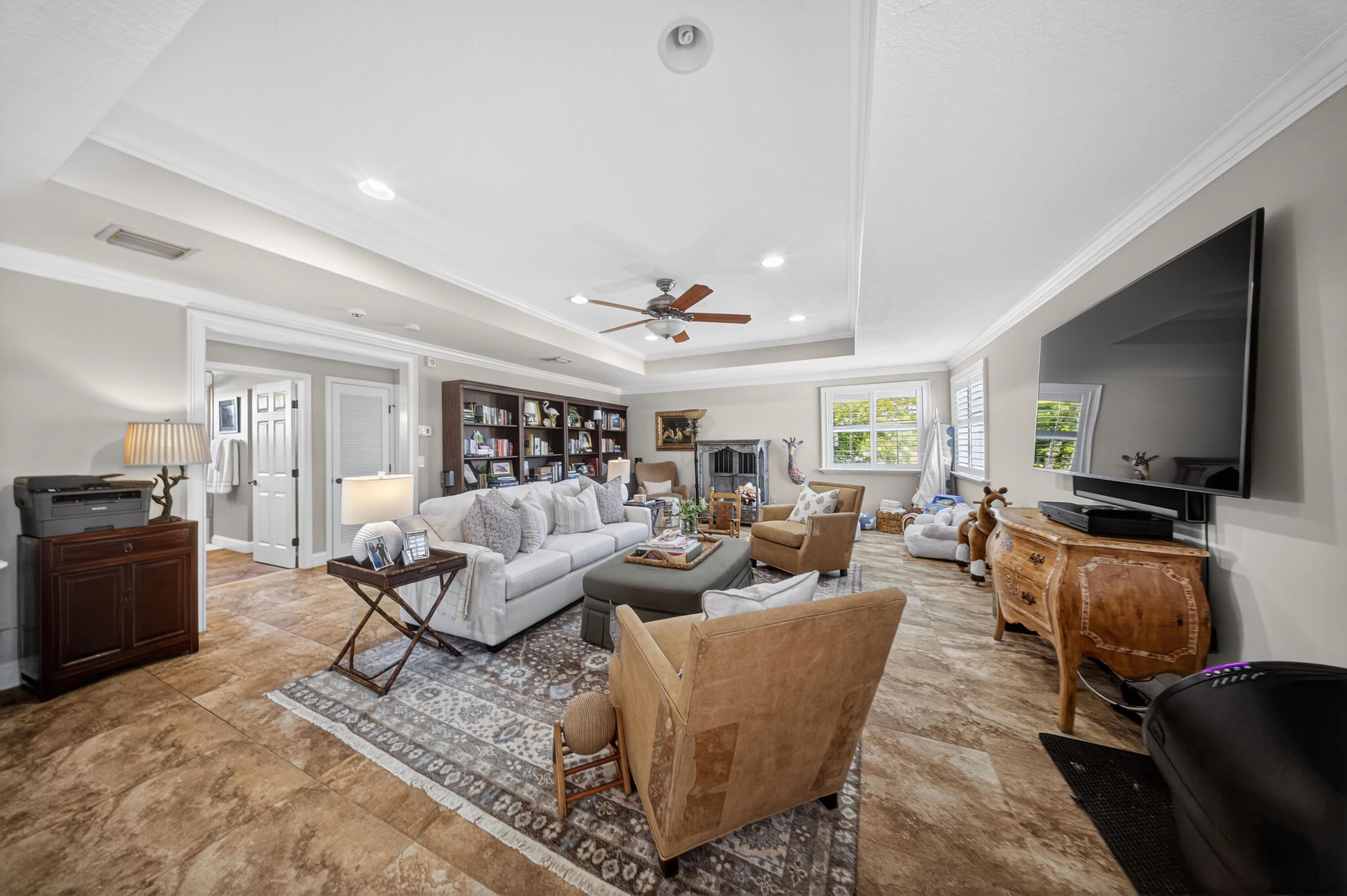 1315 Southeast Conference Circle Stuart, FL 34997 - Photo 37 of 55 a living room with furniture and a flat screen tv