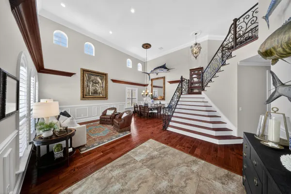 a view of an entryway with wooden floor