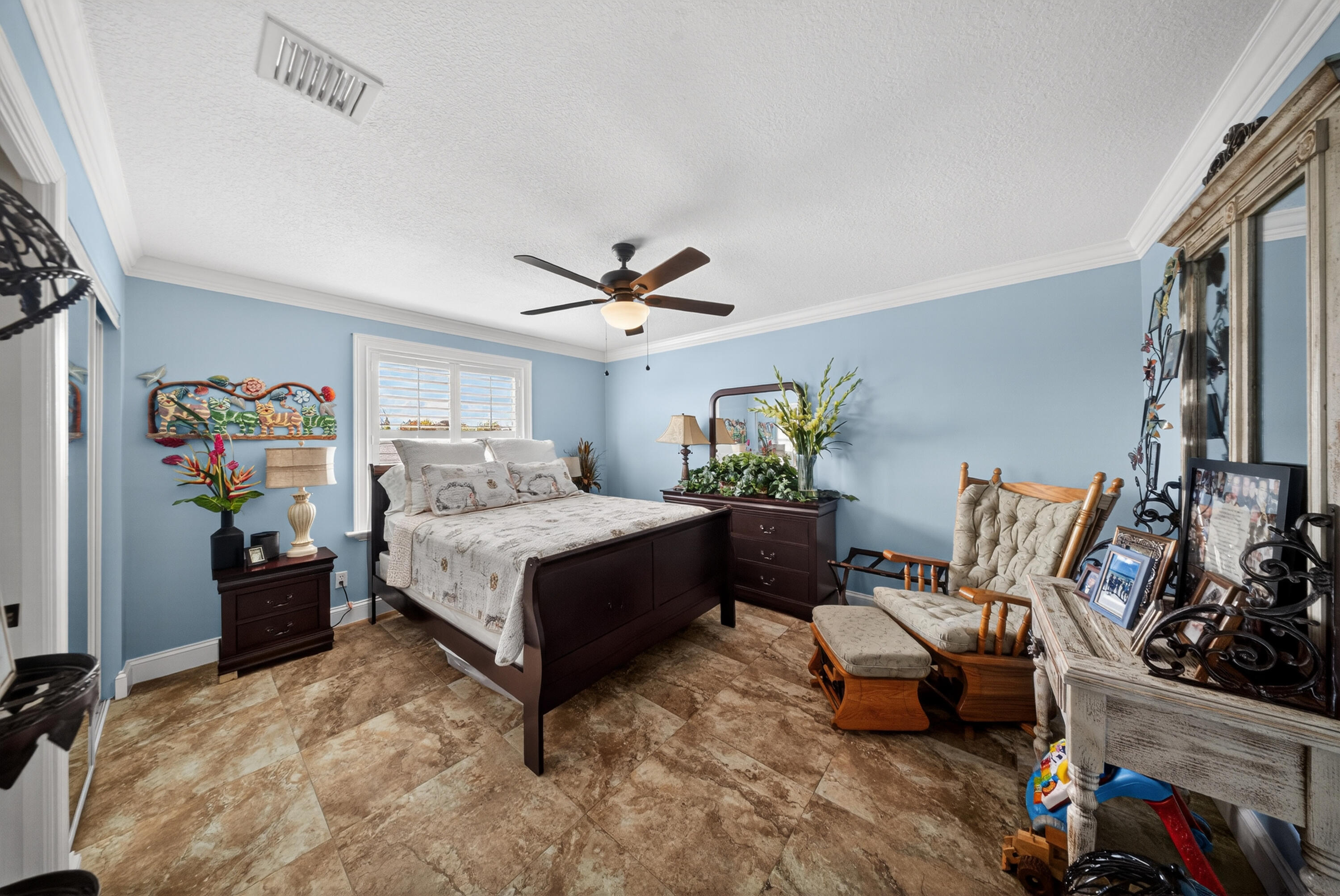 1315 Southeast Conference Circle Stuart, FL 34997 - Photo 42 of 55 a bedroom with furniture and a bed