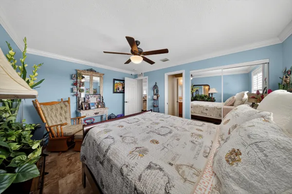 a view of a house with backyard porch and sitting area