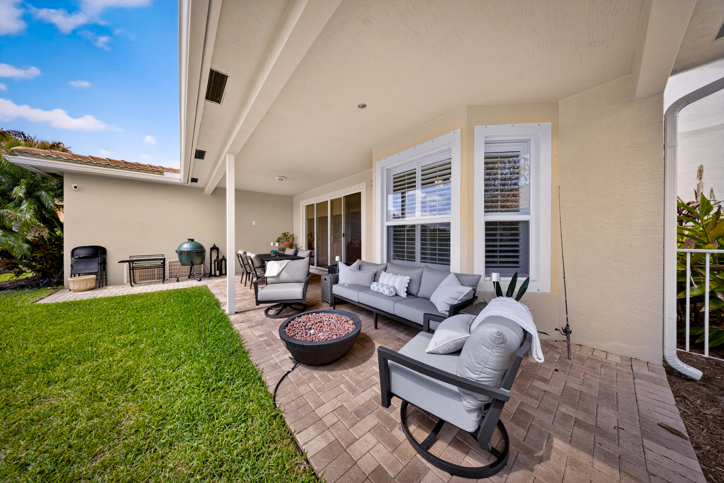1315 Southeast Conference Circle Stuart, FL 34997 - Photo 49 of 55 a living room with furniture and a table