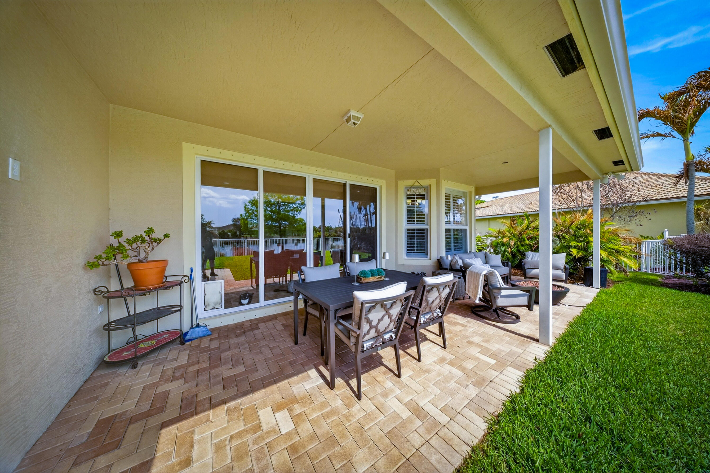 1315 Southeast Conference Circle Stuart, FL 34997 - Photo 50 of 55 a view of a patio with a dining table and chairs