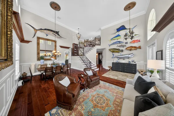 a view of a dining room with furniture and wooden floor