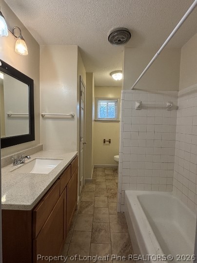 816 Shaw Mill Road, Unit 13 Fayetteville, NC 28311 - Photo 5 of 9 a bathroom with a sink a toilet a mirror and bathtub