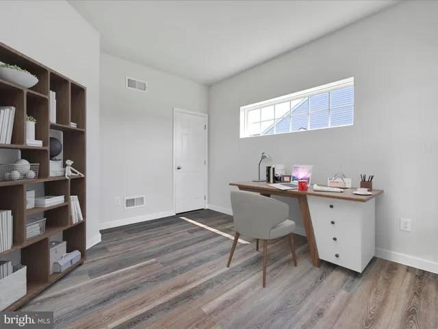 a room with furniture and wooden floor