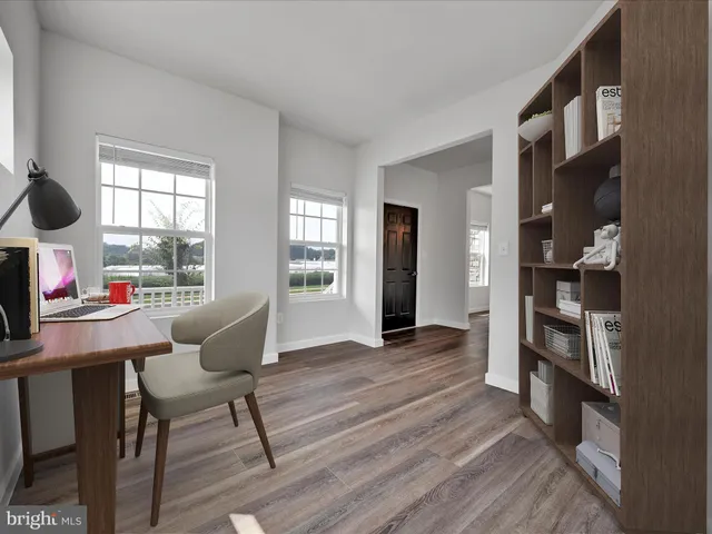a workspace with furniture window and wooden floor