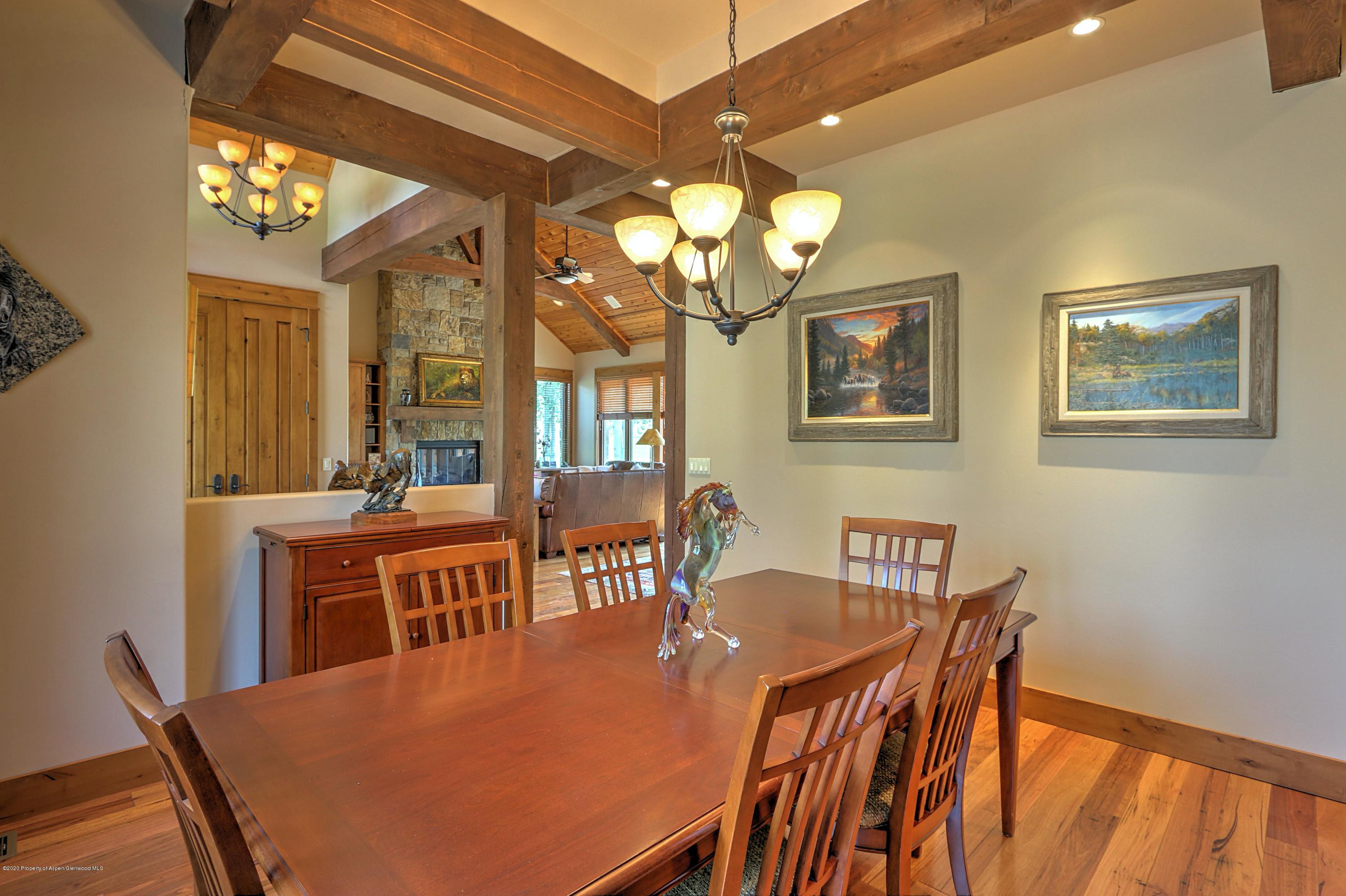 54 Diamond A Ranch Road Carbondale, CO 81623 - Photo 14 of 43 a view of a dining room with furniture and chandelier
