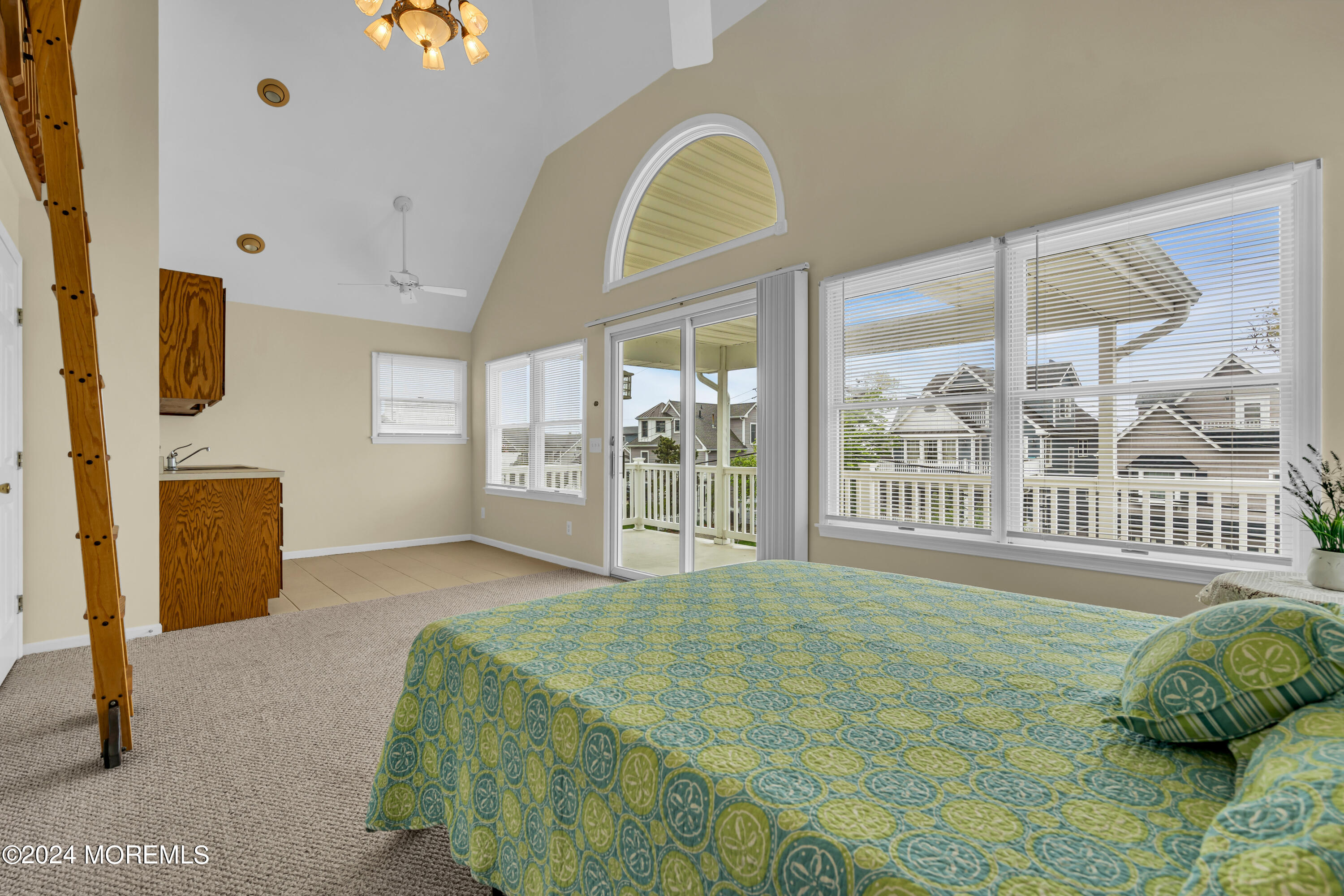 564 Perch Avenue Manasquan, NJ 08736 - Photo 21 of 49 a bed sitting in a bedroom next to a large window