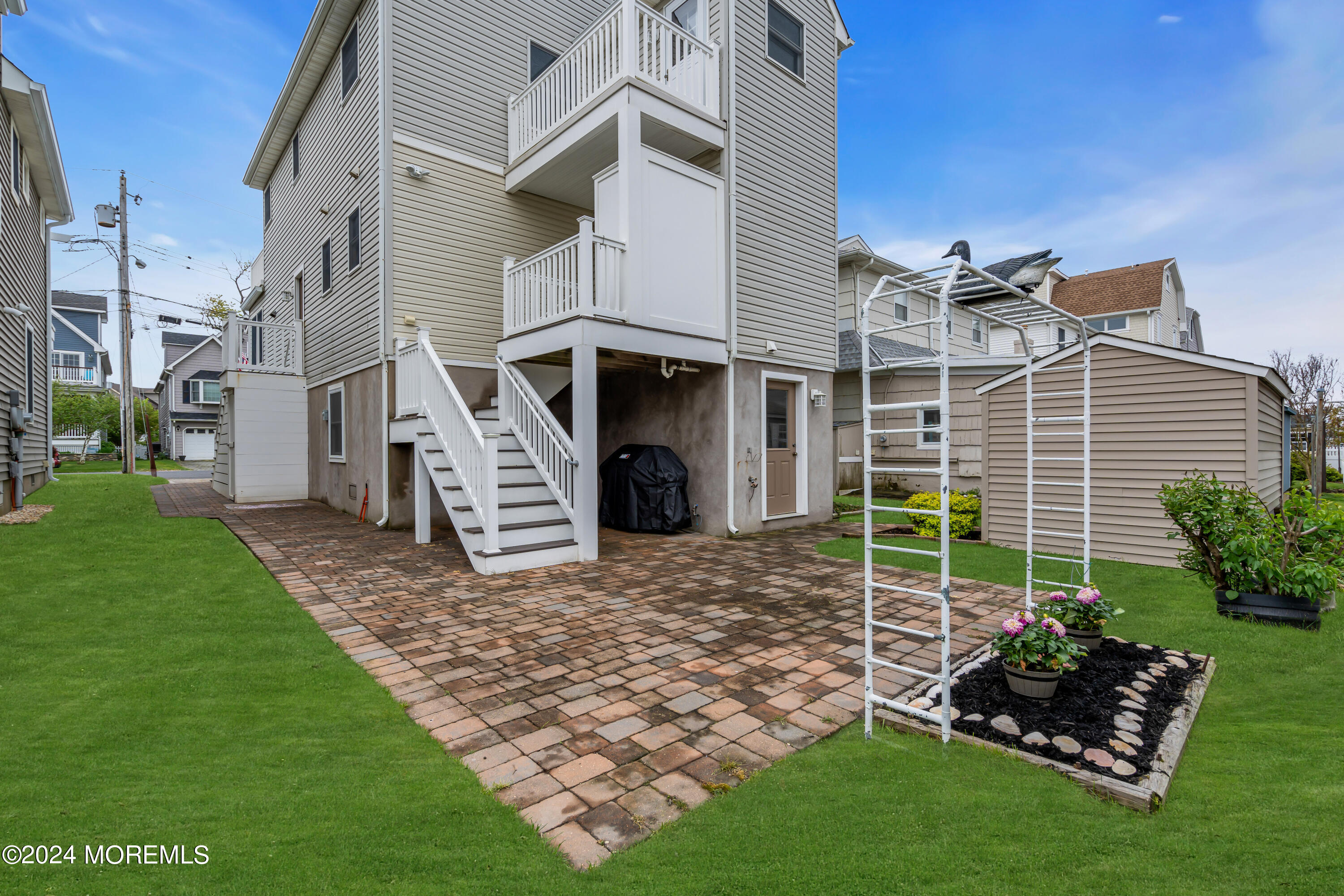 564 Perch Avenue Manasquan, NJ 08736 - Photo 33 of 49 a front view of a house with garden