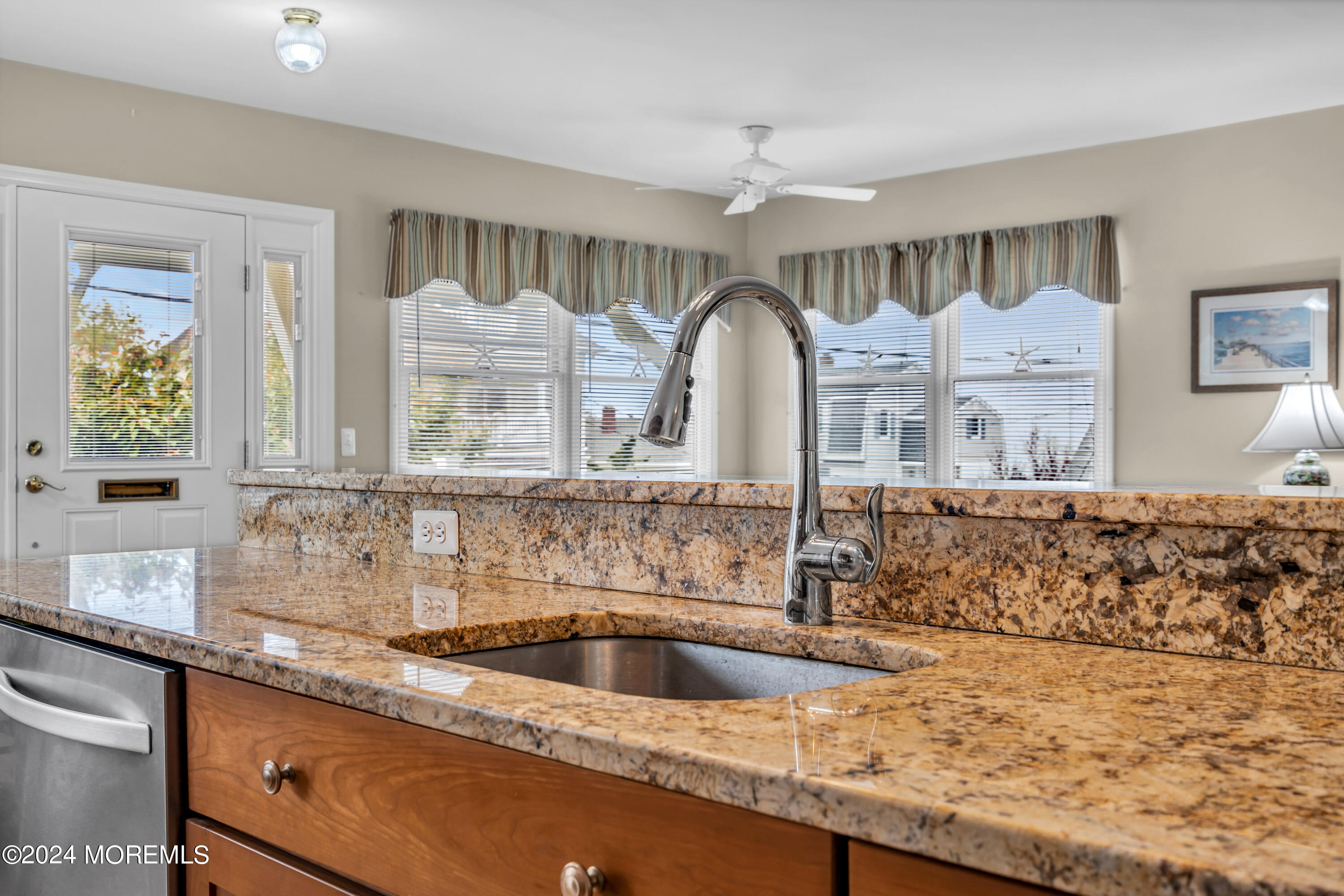 564 Perch Avenue Manasquan, NJ 08736 - Photo 10 of 49 a bathroom with a sink and a large mirror