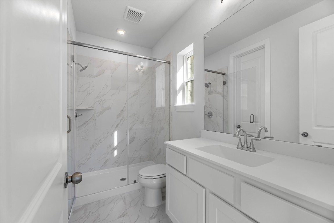 113 Meadow Beauty Lane Georgetown, TX 78633 - Photo 13 of 23 a bathroom with a sink toilet and shower