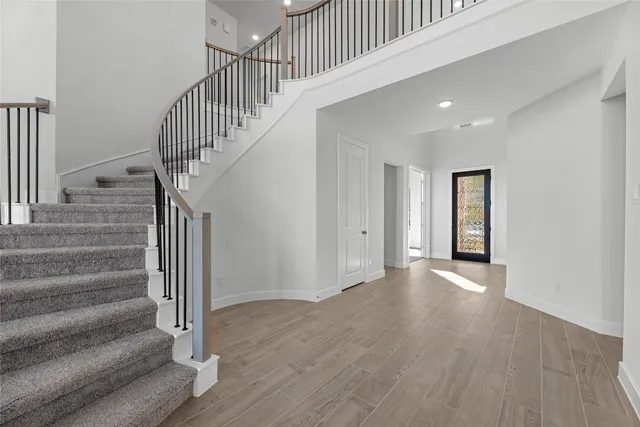 a view of an entryway with wooden floor