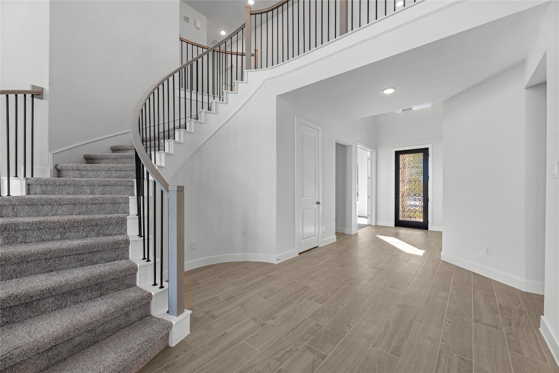 113 Meadow Beauty Lane Georgetown, TX 78633 - Photo 14 of 23 a view of an entryway with wooden floor