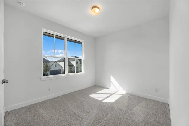 front view of a house with a garden