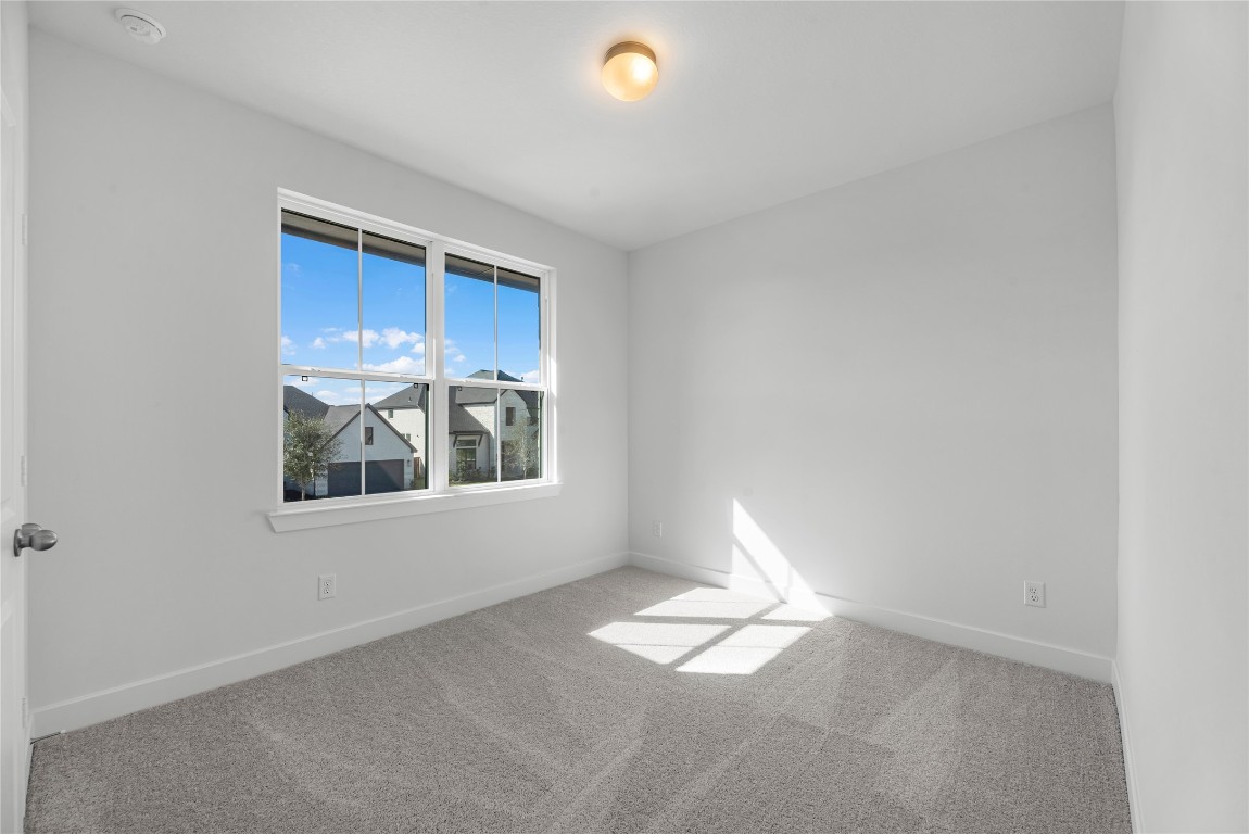 113 Meadow Beauty Lane Georgetown, TX 78633 - Photo 17 of 23 a view of empty room with windows