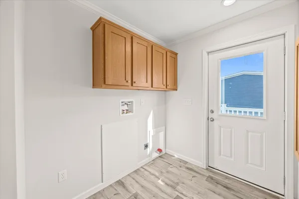 a view of an entryway with wooden floor