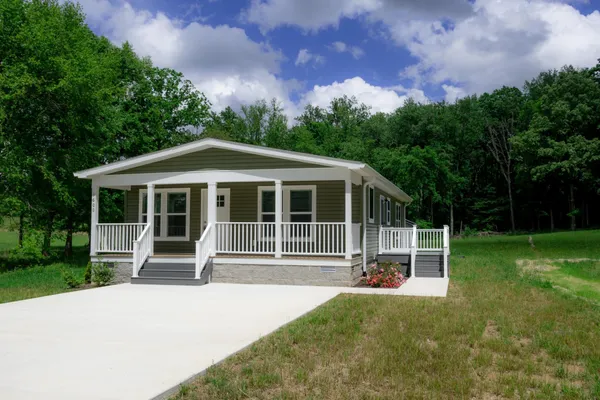 a house with garden in front of it