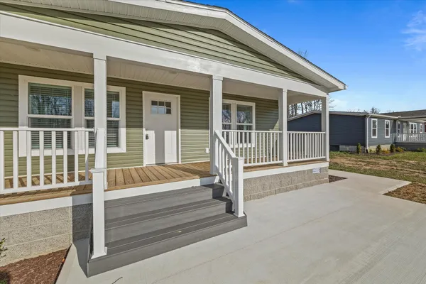 front view of a house with a small yard