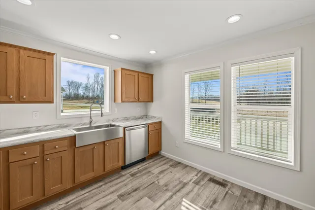 a view of a kitchen with a sink and a window
