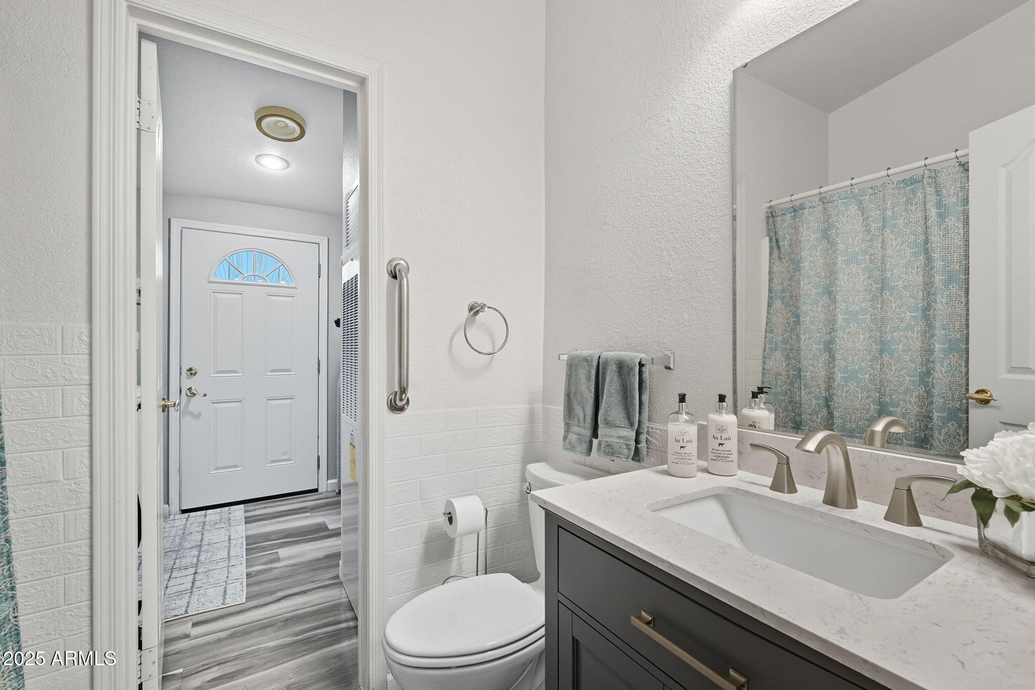 3700 South Tomahawk Road, Unit 39 Apache Junction, AZ 85119 - Photo 33 of 53 a bathroom with a granite countertop sink toilet a mirror and shower