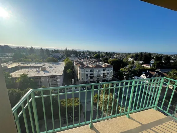 a view of a balcony with an ocean view