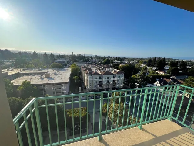 a view of a balcony with an ocean view