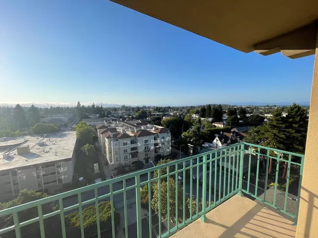 a view of a balcony with city view