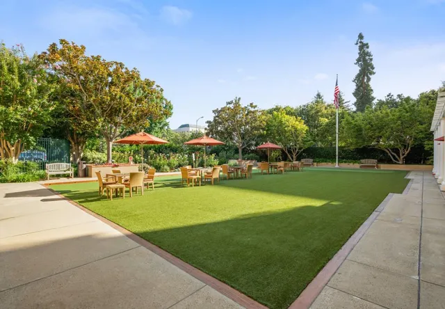 a view of a park with lawn chairs and a lawn chairs