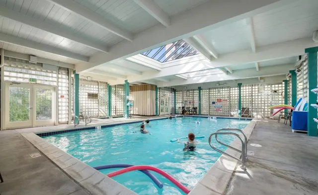 a very nice looking dining room with a large window