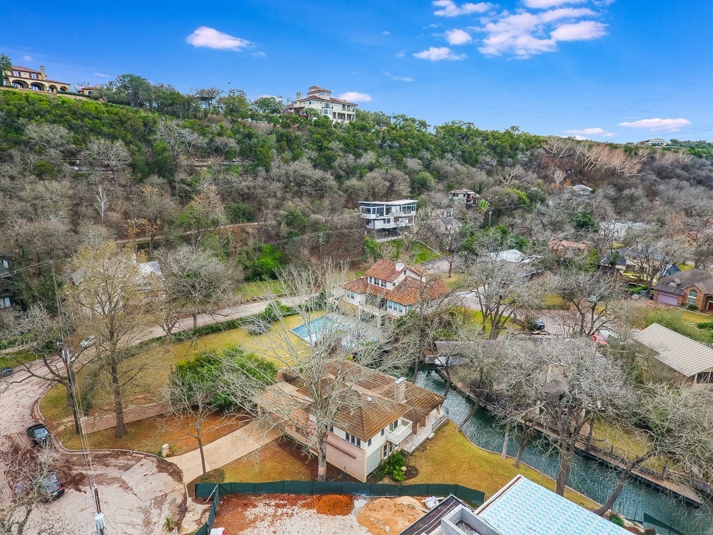 6703 Pixie Cove Austin, TX 78746 - Photo 1 of 1 a view of a lake with mountains in the background