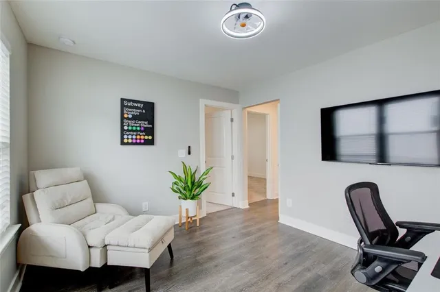 a work room with furniture and wooden floor