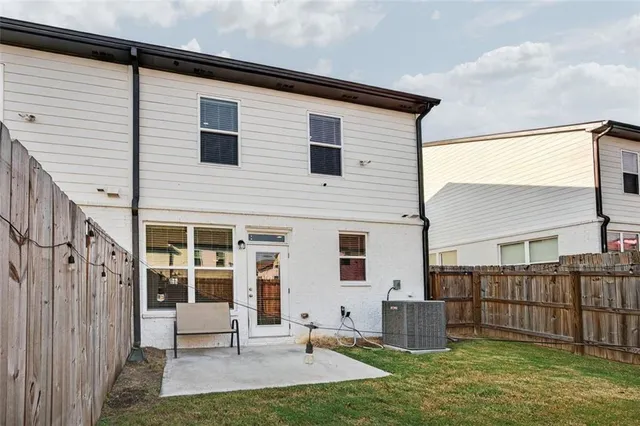 a backyard of a house with barbeque oven